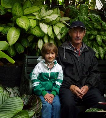 Grandfather and Granddaughter. Winter Garden